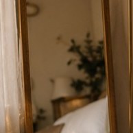 Arched full-length mirror
